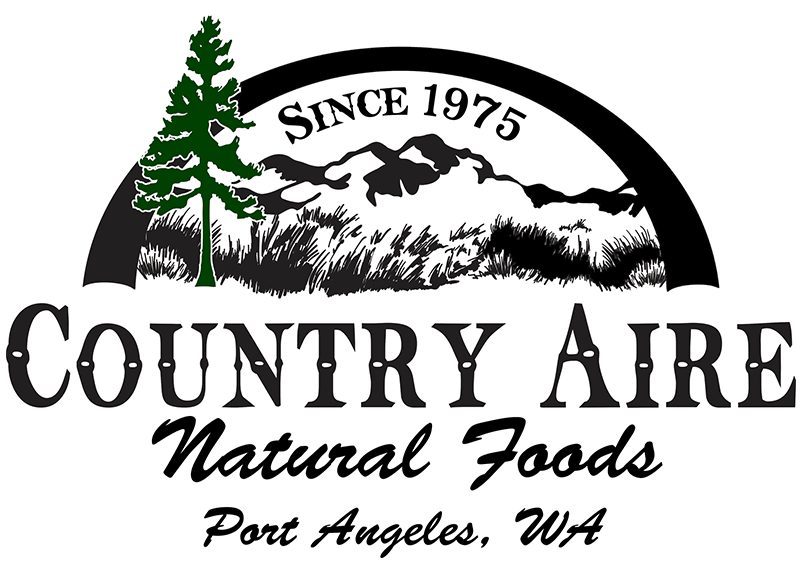 Country Aire Natural Foods logo with a tree and mountain design, established in 1975, located in Port Angeles, WA.